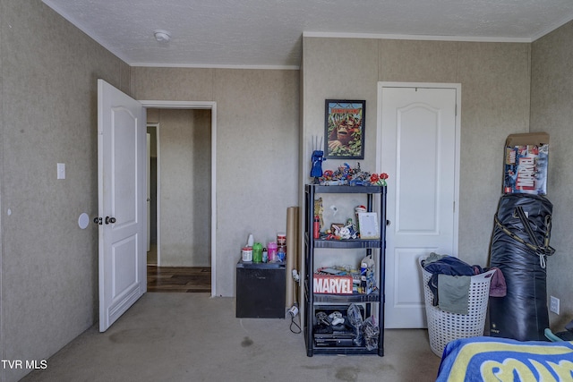 bedroom featuring a textured ceiling and ornamental molding