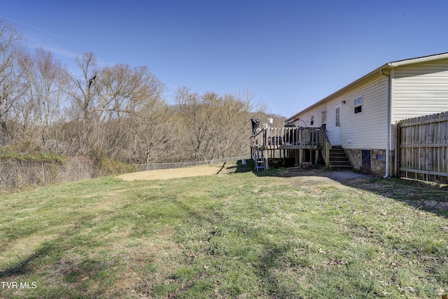 view of yard featuring stairway, fence, and a wooden deck