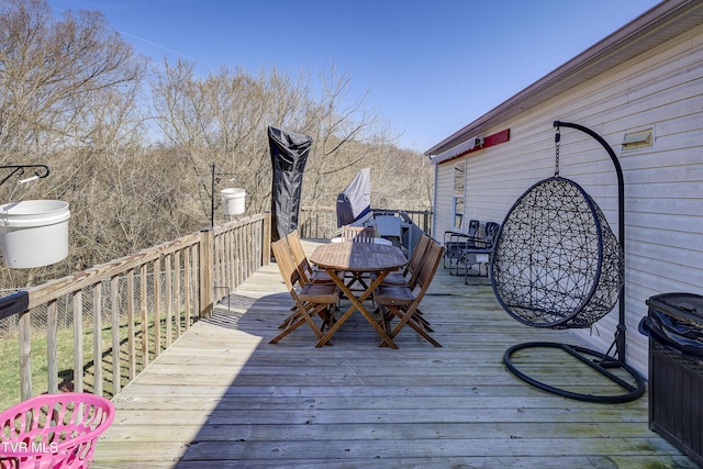 deck featuring outdoor dining area