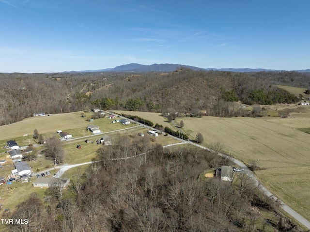 aerial view featuring a forest view, a rural view, and a mountain view