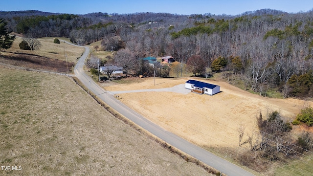 bird's eye view featuring a rural view and a forest view