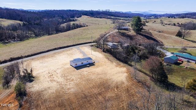 aerial view featuring a rural view and a mountain view