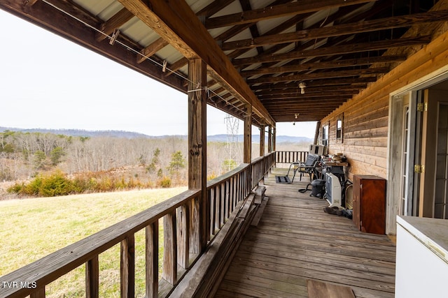 wooden deck featuring a mountain view