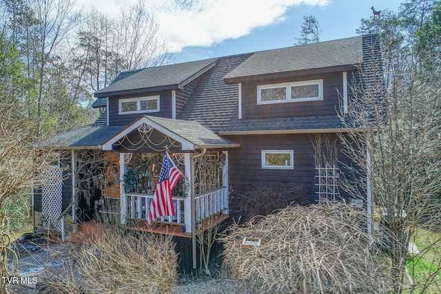 view of front of home featuring roof with shingles