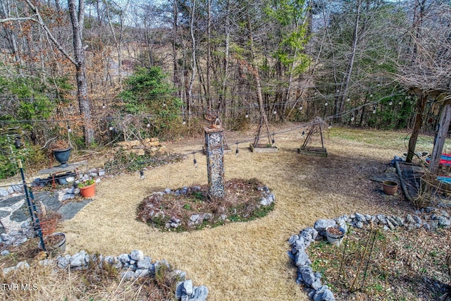 view of yard featuring a wooded view