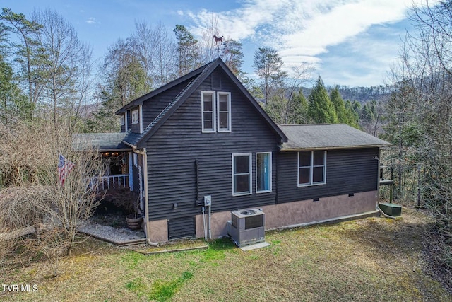 back of house with a yard, crawl space, and cooling unit