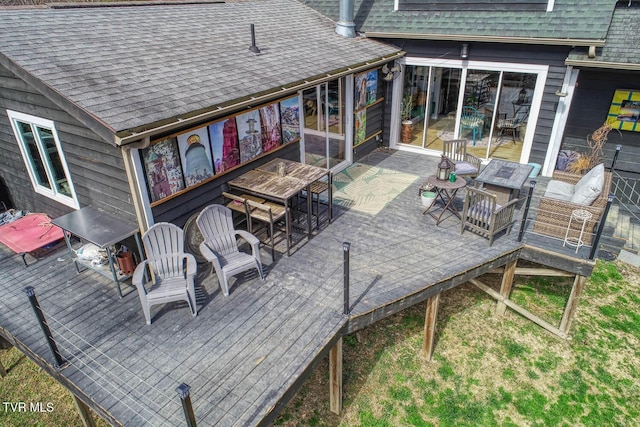 view of patio with an outdoor living space and a wooden deck