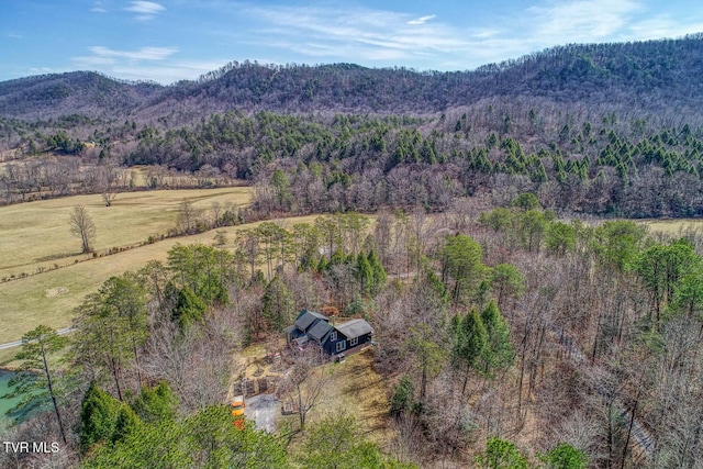 bird's eye view with a forest view and a mountain view