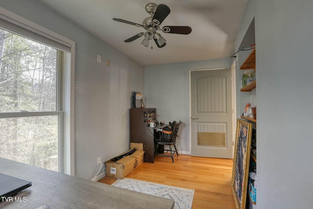 office area with wood finished floors and a ceiling fan