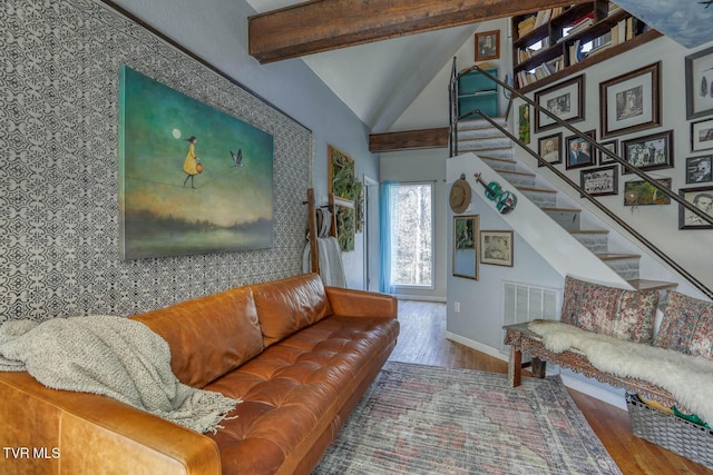 living room with stairs, beam ceiling, visible vents, and wood finished floors