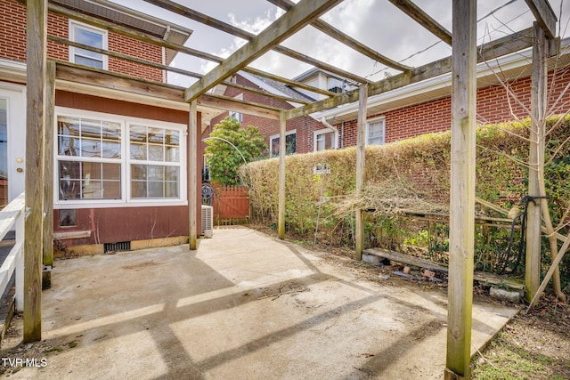 view of patio / terrace with fence and a pergola