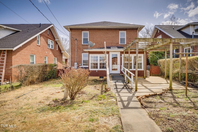 view of front of property with crawl space, a patio, a pergola, and brick siding