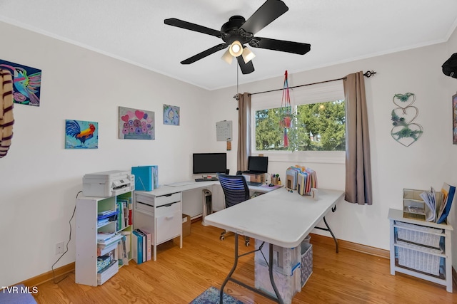 home office featuring baseboards, ornamental molding, and wood finished floors