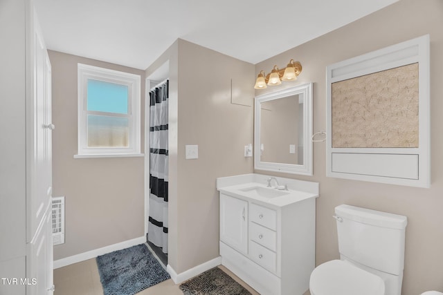 bathroom with toilet, visible vents, vanity, baseboards, and a shower with curtain