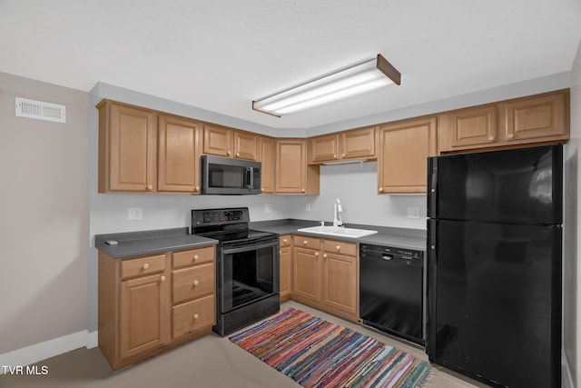 kitchen with a sink, visible vents, baseboards, black appliances, and dark countertops