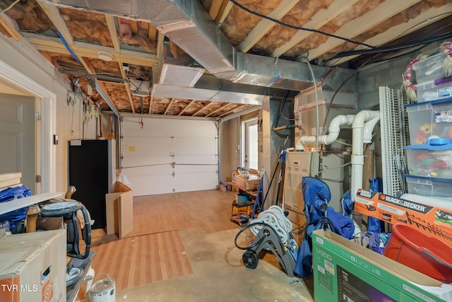 garage with freestanding refrigerator