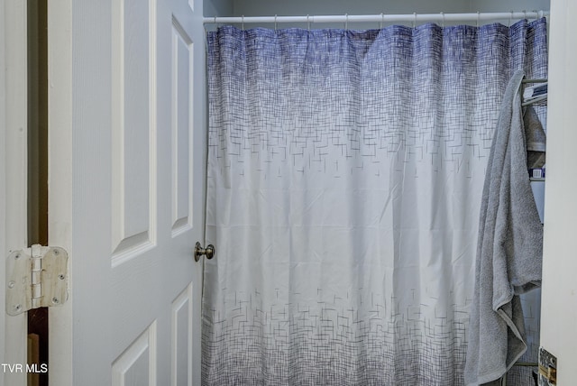 bathroom with a shower with curtain