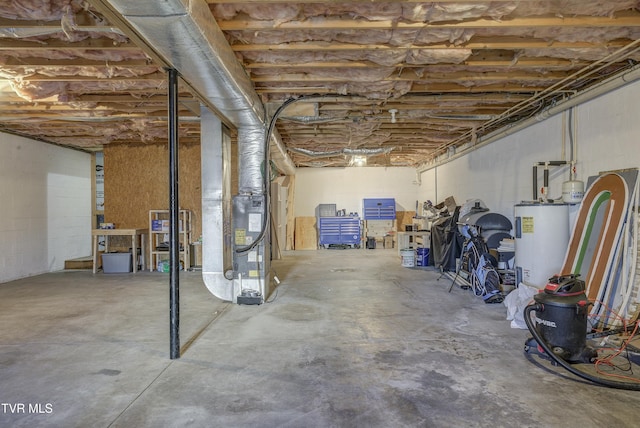 unfinished below grade area featuring water heater