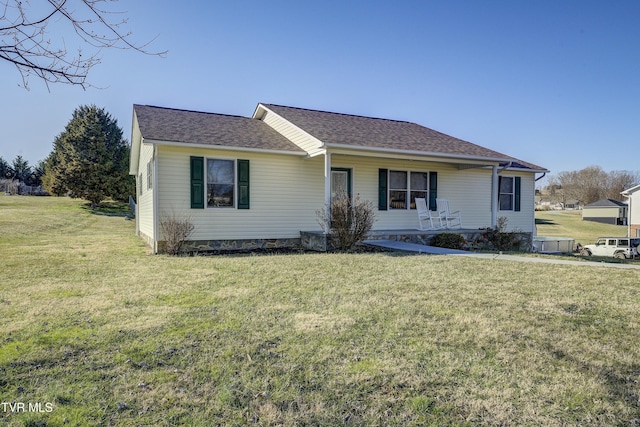 single story home with roof with shingles and a front lawn