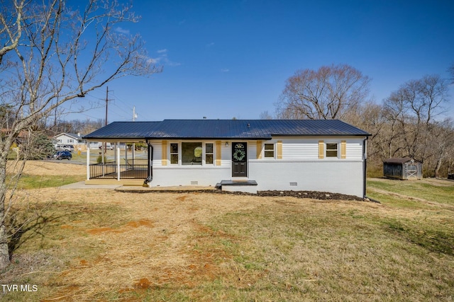 single story home featuring crawl space, covered porch, a front lawn, and metal roof