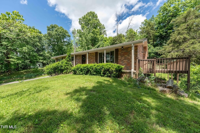 472 Harmony Rd, Jonesborough, TN 37659 - view of front of home featuring brick siding, a front lawn, and a wooden deck