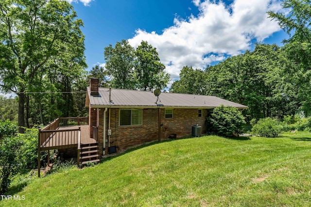 472 Harmony Rd, Jonesborough, TN 37659 - rear view of house with a chimney, a deck, a lawn, and metal roof