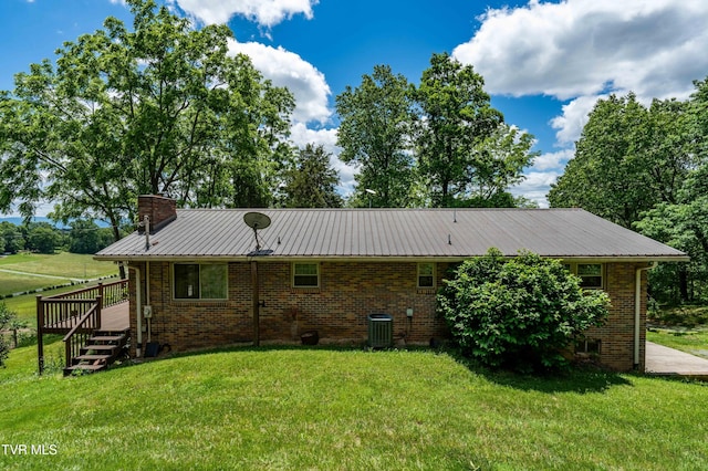 472 Harmony Rd, Jonesborough, TN 37659 - rear view of property featuring central air condition unit, a deck, a yard, and a chimney