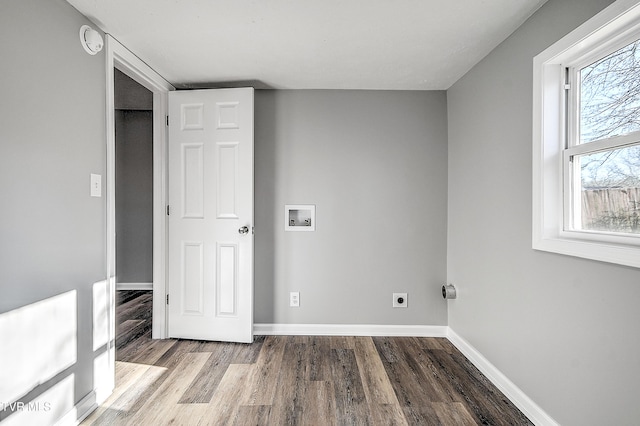 interior space featuring hookup for a washing machine, laundry area, wood finished floors, baseboards, and electric dryer hookup