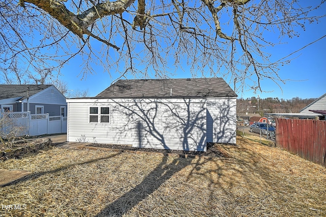 view of outdoor structure with fence