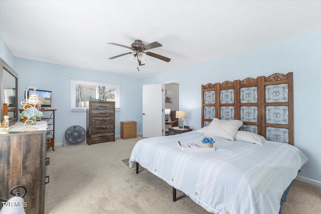 bedroom with carpet flooring, ceiling fan, and baseboards