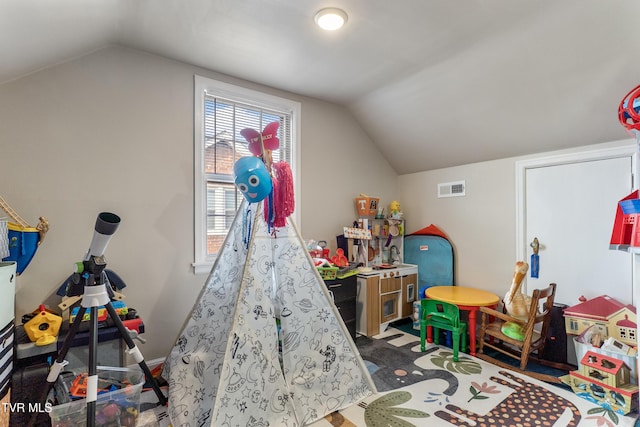 game room featuring lofted ceiling and visible vents