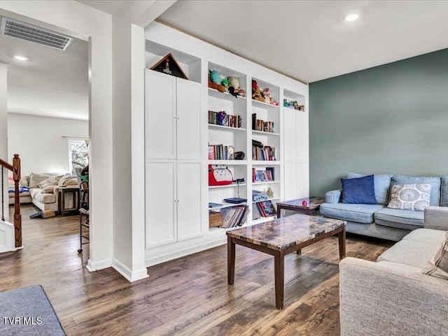 living area with recessed lighting, visible vents, stairway, dark wood-type flooring, and baseboards