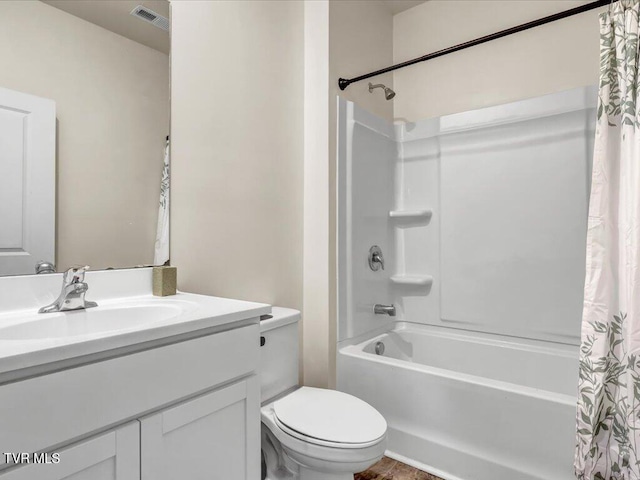 full bath with toilet, vanity, shower / bath combo with shower curtain, and visible vents