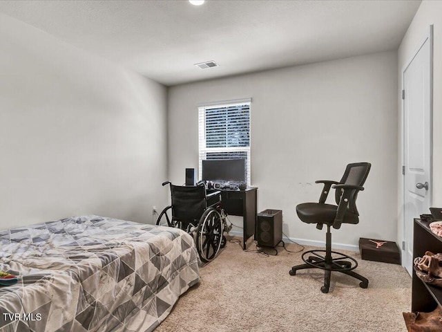 carpeted bedroom with visible vents and baseboards