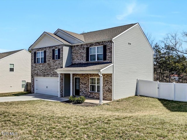 traditional-style house with a front yard, brick siding, fence, and driveway