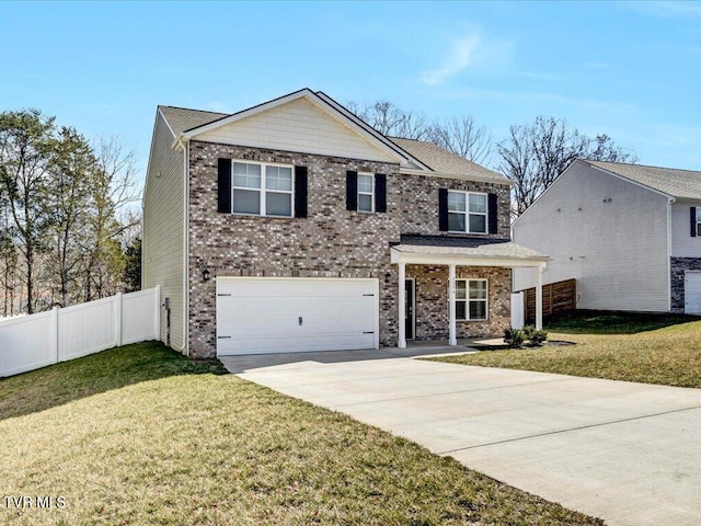 traditional-style house featuring an attached garage, driveway, a front yard, and fence