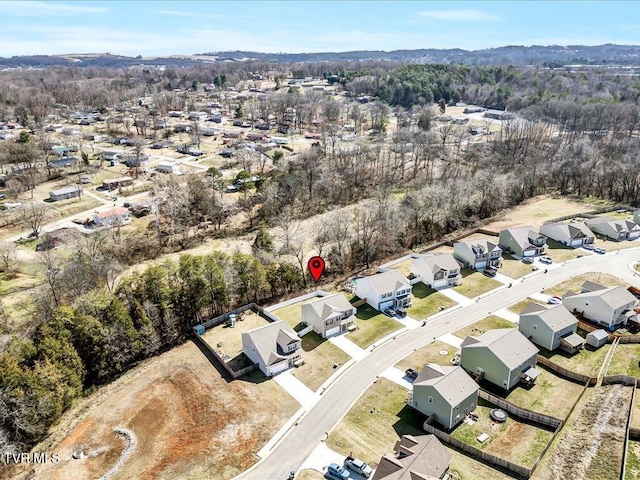 birds eye view of property with a residential view