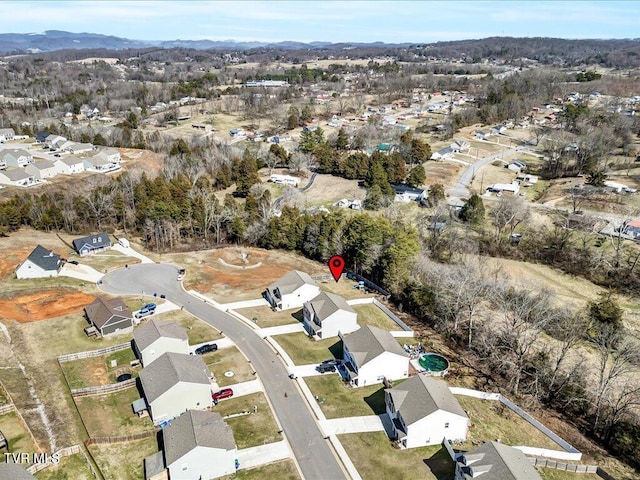 birds eye view of property with a residential view