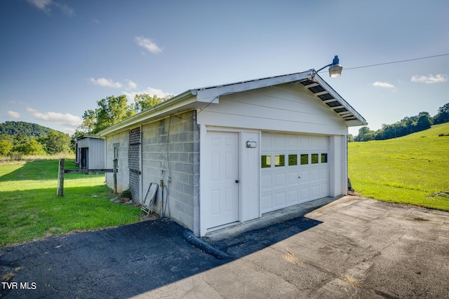 detached garage featuring driveway