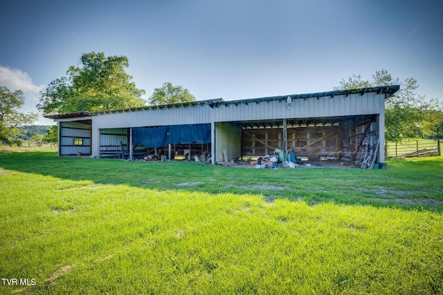 view of pole building with a lawn