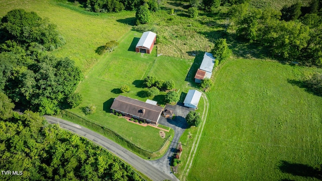 birds eye view of property with a rural view