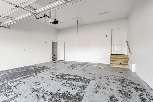 garage featuring baseboards and a garage door opener