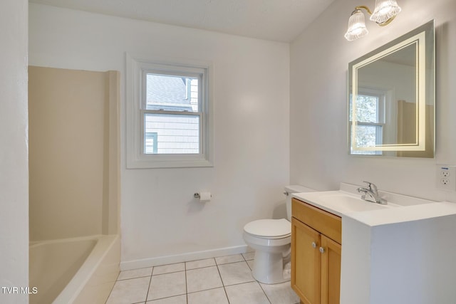 bathroom featuring tile patterned floors, baseboards, toilet, and vanity