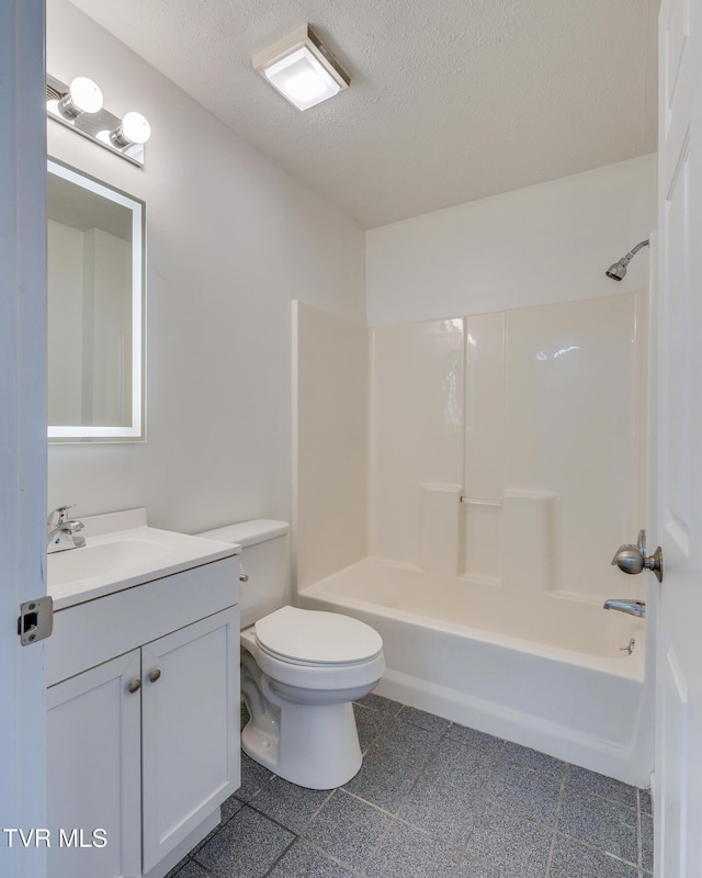 full bath with toilet, tub / shower combination, a textured ceiling, and vanity