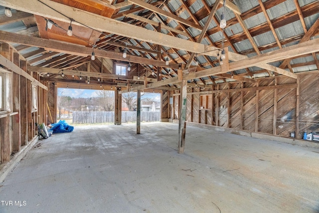 miscellaneous room with lofted ceiling