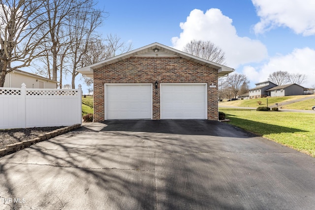 garage with fence