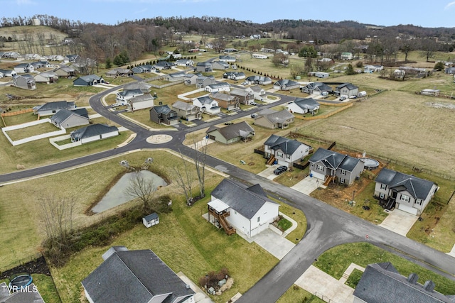 birds eye view of property with a residential view