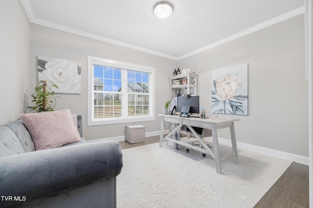 home office with baseboards, wood finished floors, and crown molding