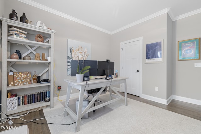 home office featuring ornamental molding, baseboards, and wood finished floors