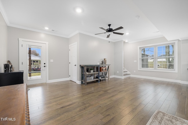 living room with recessed lighting, wood finished floors, baseboards, stairs, and crown molding